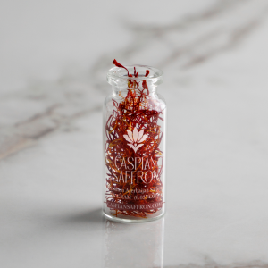 Close-up of Caspian Saffron 1 gram jar with handpicked threads